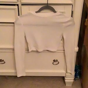 I’m selling a white crop top, works well over swimwear